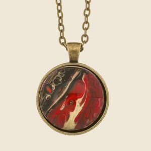 Handmade Abstract Pendant Necklace – Red, Black & Gold in a Round Brass Frame